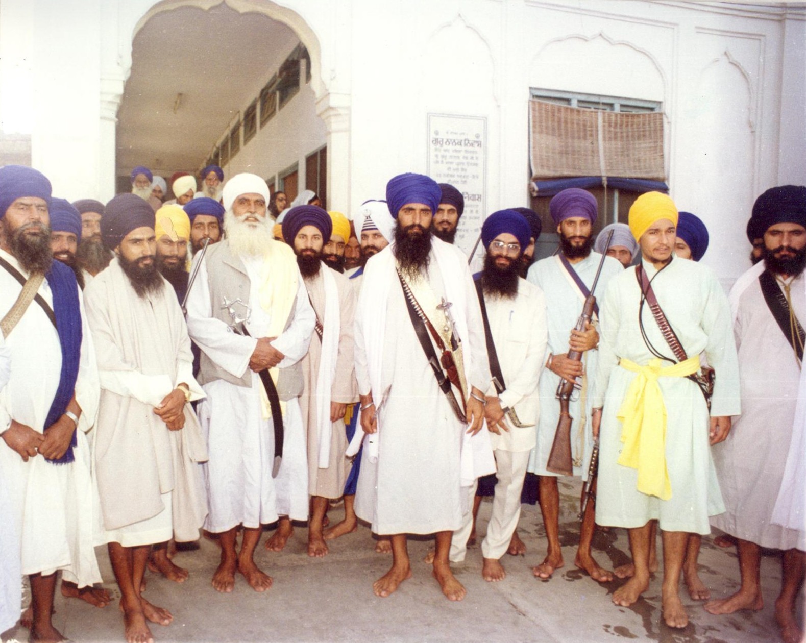 Armed Nihung Singhs marching, historical photograph